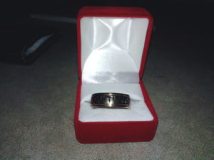 Blessed by God wedding ring in box.